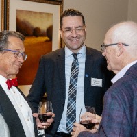 A group of men having a conversation